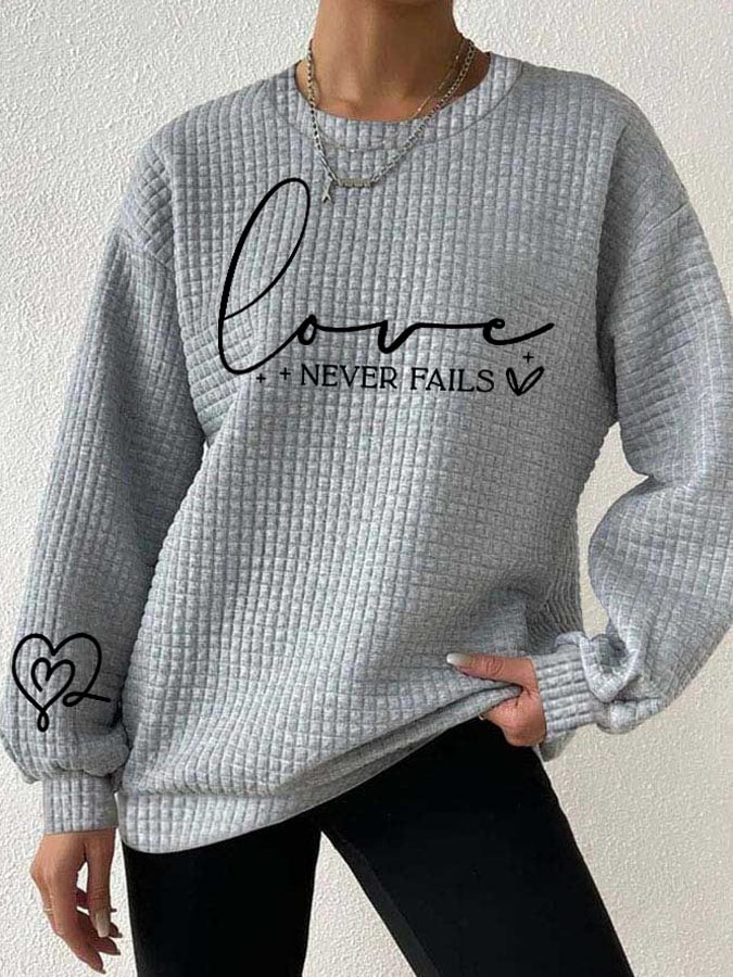 Women's Love Never Fails Heart Print Long Sleeve Sweatshirt