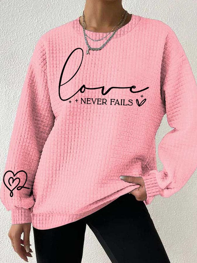 Women's Love Never Fails Heart Print Long Sleeve Sweatshirt