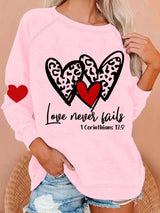 Women's Love Never Fails Heart Print Round Neck Sweatshirt
