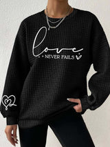 Women's Love Never Fails Heart Print Long Sleeve Sweatshirt